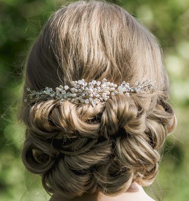 Pearl and crystal wedding hairvine on bride with hair up