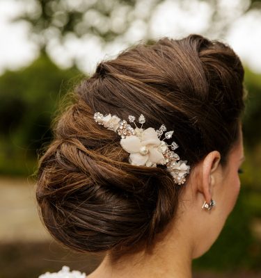Model with blush pink wedding hair comb