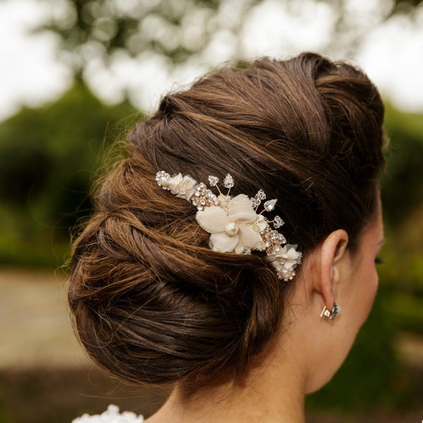 Model with blush pink wedding hair comb